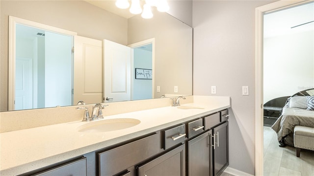 bathroom with tile patterned flooring and vanity