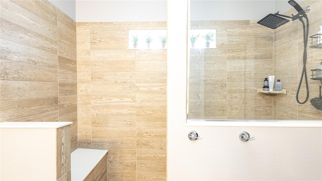 bathroom with tiled shower