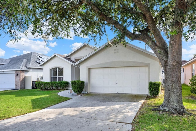 ranch-style home with a garage and a front lawn