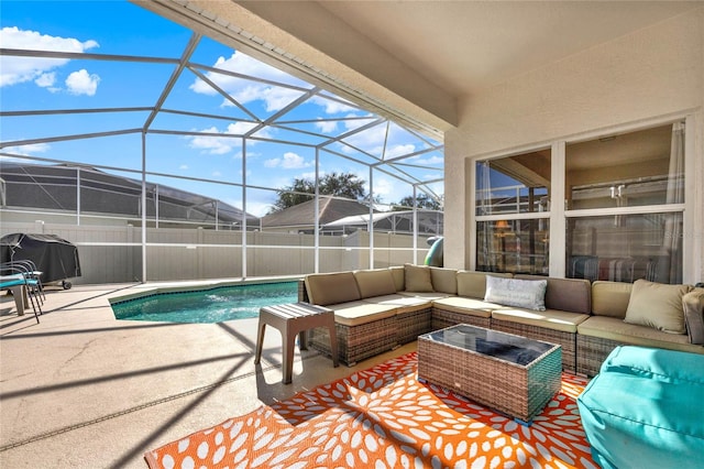 view of swimming pool featuring outdoor lounge area, glass enclosure, a patio area, and a grill