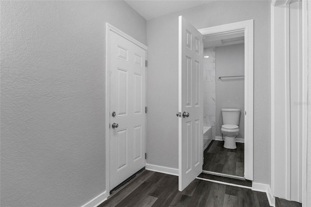 bathroom with toilet and hardwood / wood-style flooring