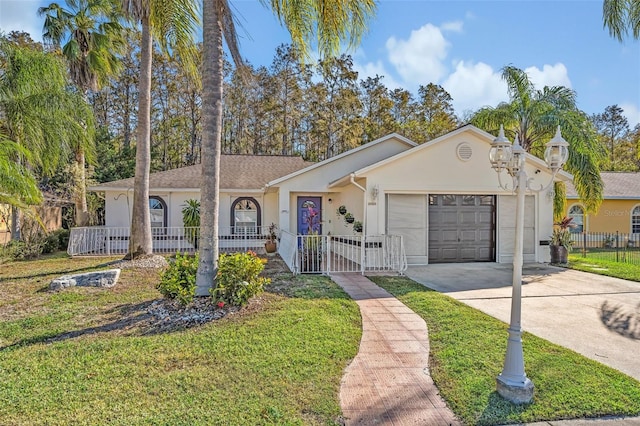 ranch-style house with a garage and a front lawn