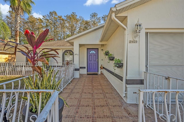 property entrance featuring covered porch