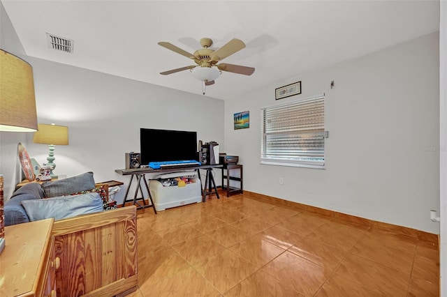 tiled living room with ceiling fan