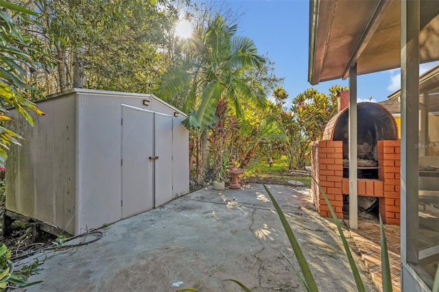 view of patio featuring a shed