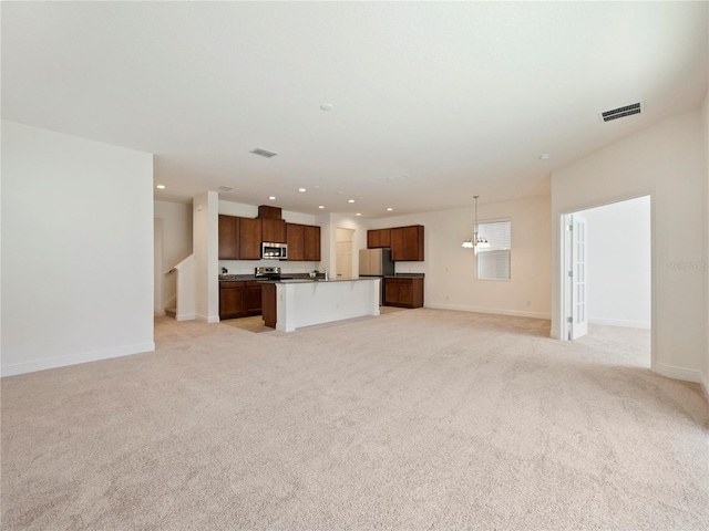 unfurnished living room with light carpet