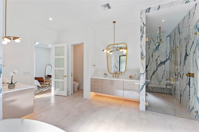 bathroom with a marble finish shower, recessed lighting, visible vents, toilet, and vanity