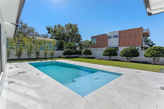 view of pool featuring a yard, a patio area, a fenced backyard, and a fenced in pool