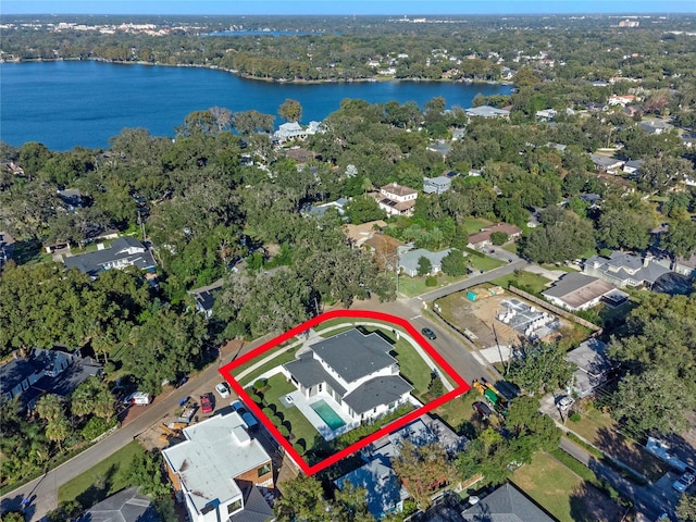 drone / aerial view with a water view and a residential view