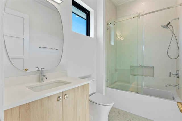 full bathroom with toilet, enclosed tub / shower combo, vanity, and speckled floor