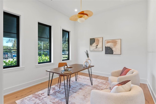 office area with recessed lighting, baseboards, and light wood finished floors