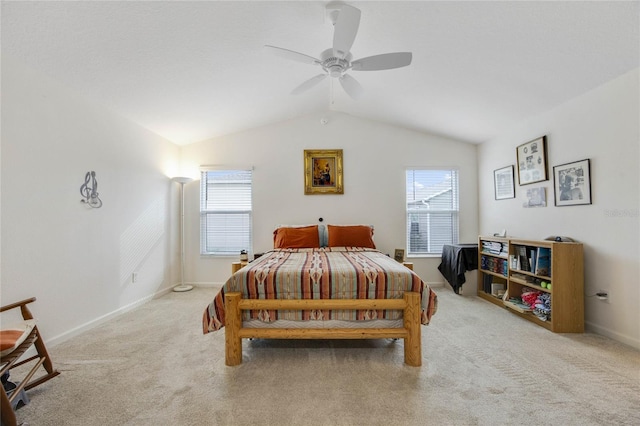 carpeted bedroom with multiple windows, lofted ceiling, and ceiling fan