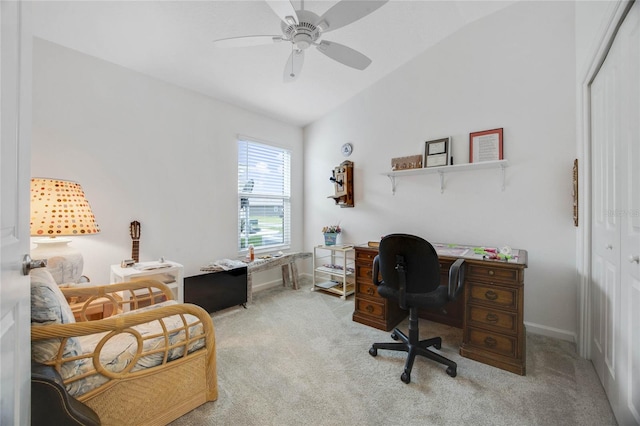 carpeted office featuring ceiling fan and lofted ceiling