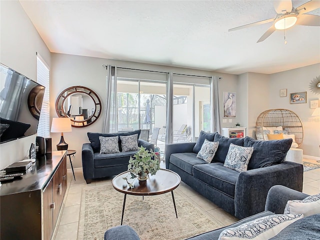 living room featuring ceiling fan and light tile patterned floors