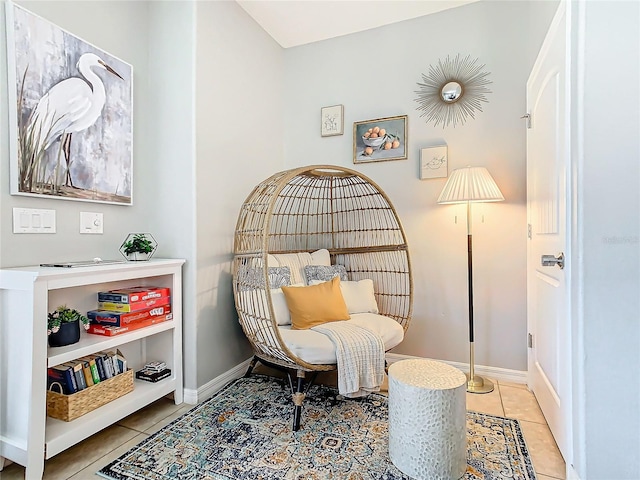 sitting room featuring light tile patterned flooring