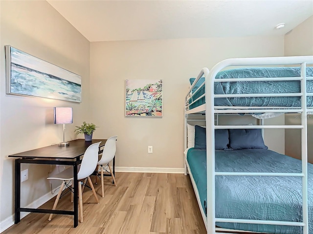 bedroom with hardwood / wood-style floors