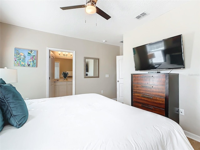 bedroom featuring ensuite bathroom, ceiling fan, and hardwood / wood-style flooring