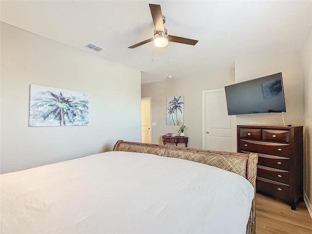 bedroom featuring light wood-type flooring and ceiling fan