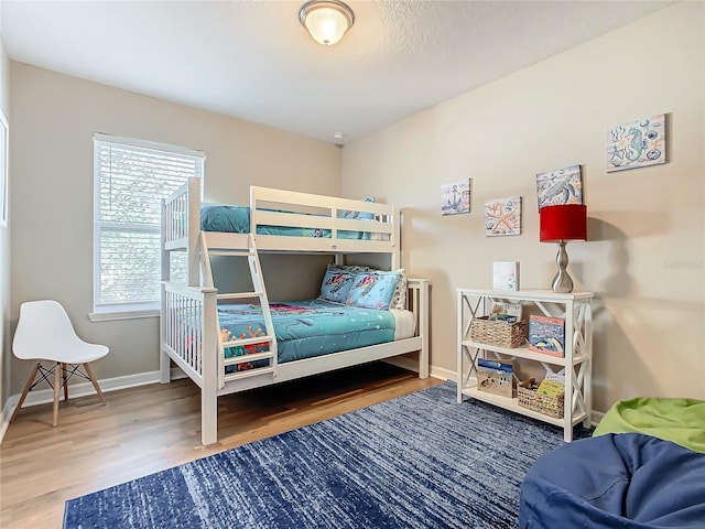 bedroom with wood-type flooring