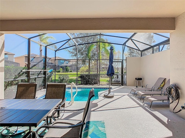 view of patio featuring glass enclosure