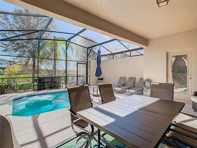 view of pool with a lanai and a patio area