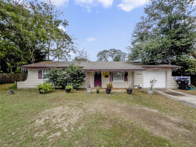 ranch-style house with a front lawn and a garage