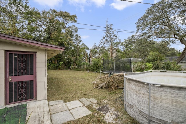 view of yard with a trampoline