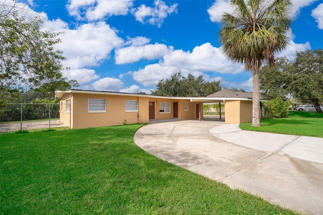 ranch-style house with a front lawn and a carport