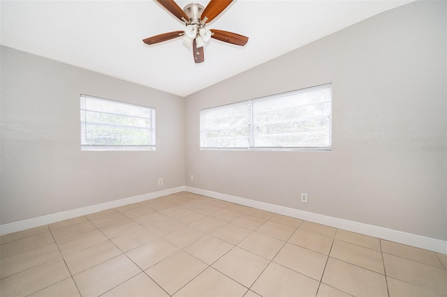 unfurnished room featuring light tile patterned floors, vaulted ceiling, and ceiling fan