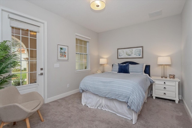 bedroom featuring light carpet