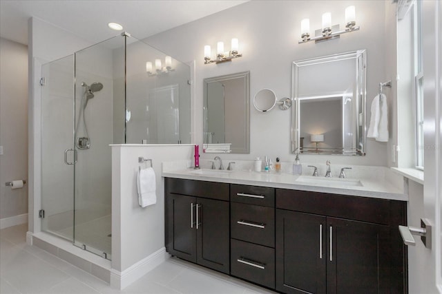 bathroom featuring tile patterned flooring, vanity, and an enclosed shower