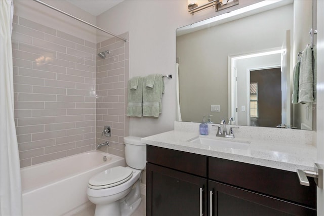 full bathroom with shower / bath combo, vanity, and toilet