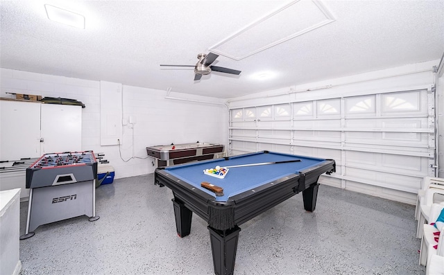 playroom with ceiling fan, pool table, and a textured ceiling