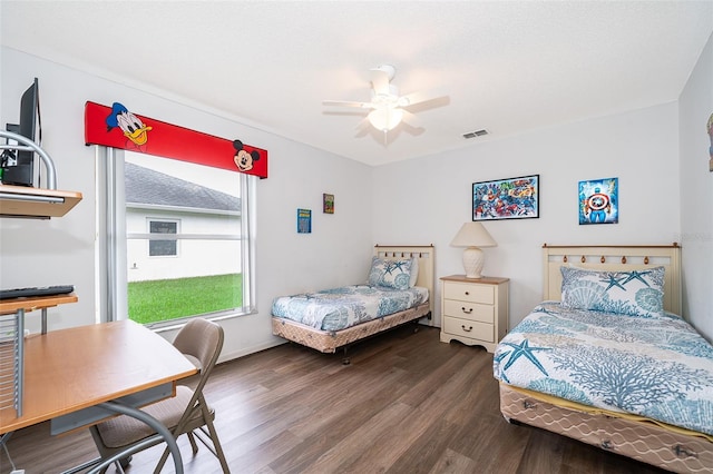 bedroom featuring ceiling fan and dark hardwood / wood-style flooring