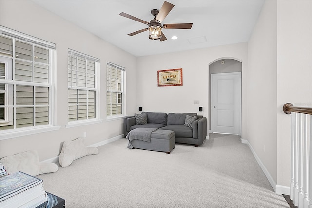 living room featuring ceiling fan and carpet floors