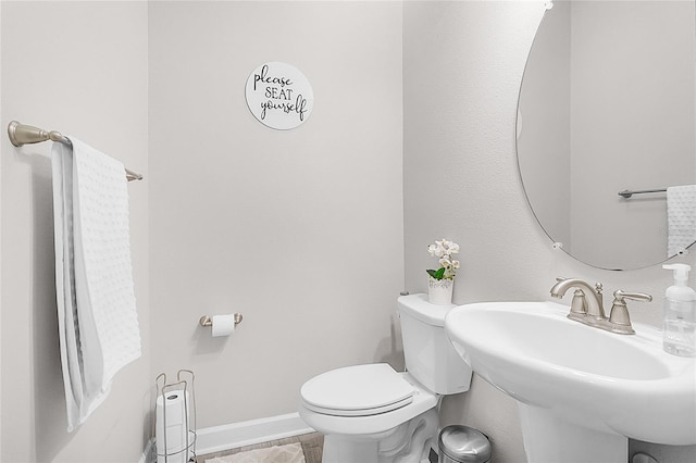 bathroom with toilet and sink