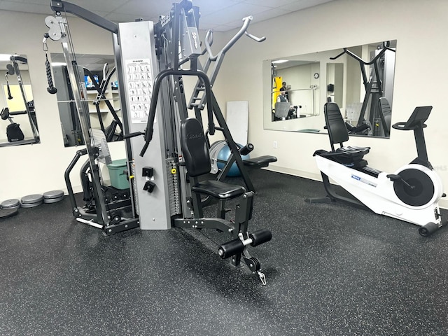 workout area with a drop ceiling