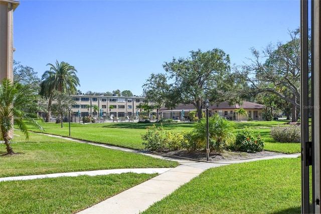 surrounding community featuring a lawn