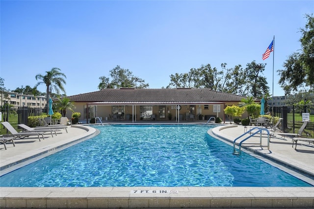 view of swimming pool with a patio area