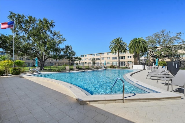 view of swimming pool with a patio