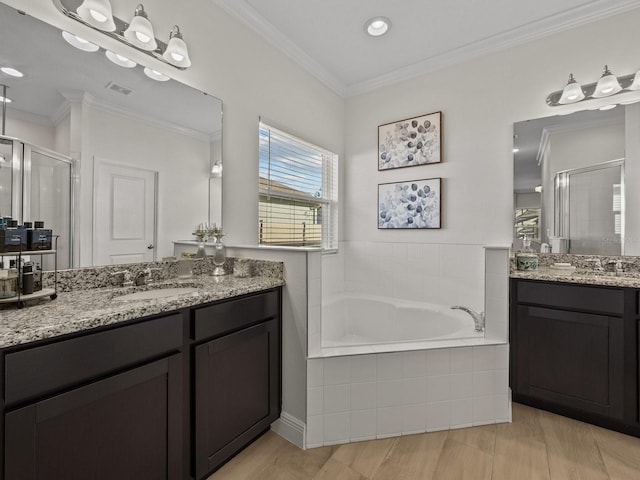 full bathroom featuring a sink, a bath, a shower stall, and crown molding