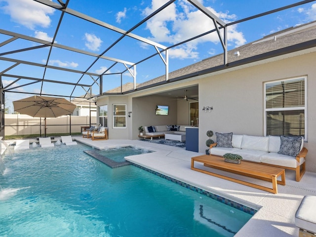 view of pool with glass enclosure, a fenced in pool, a ceiling fan, an outdoor living space, and a patio area