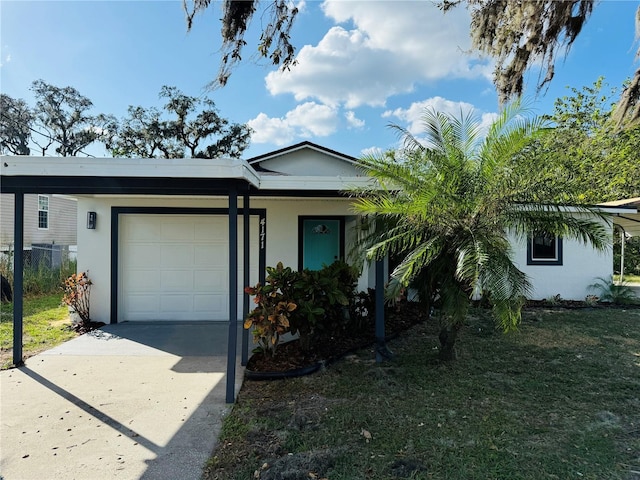 4171 Radford Rd, Bartow, FL 33830 - ranch-style home with a garage, stucco siding, concrete driveway, and a front yard