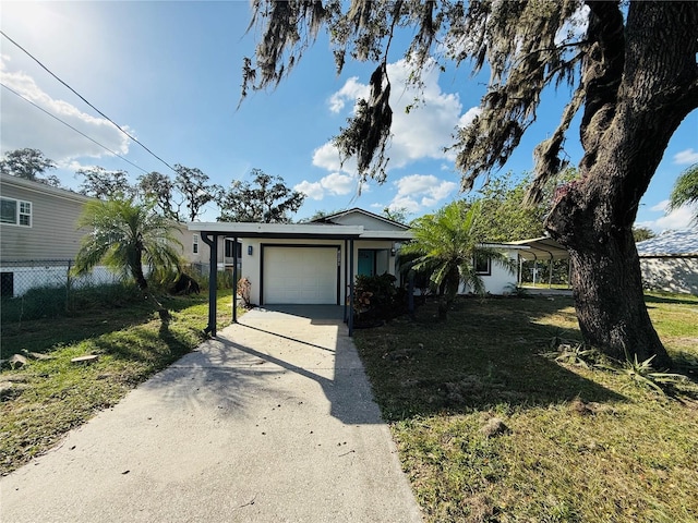 view of front of house with a garage and a front lawn