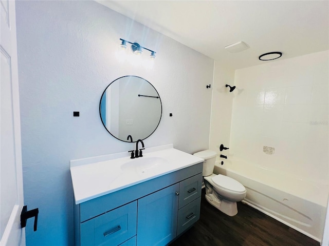 full bathroom with shower / bathing tub combination, vanity, toilet, and hardwood / wood-style floors