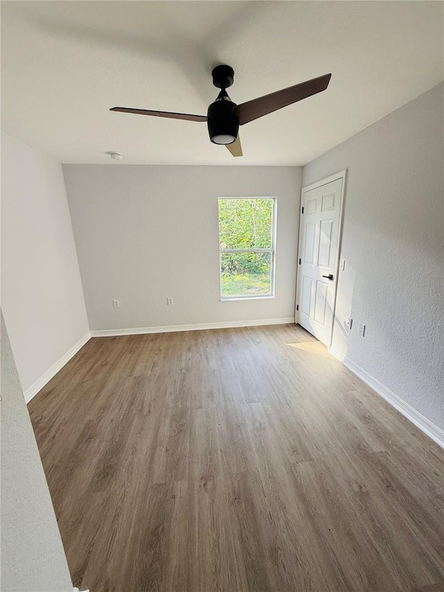 unfurnished room featuring dark hardwood / wood-style flooring