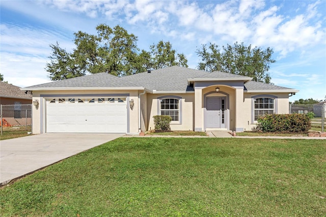 ranch-style house featuring a garage and a front yard