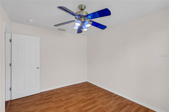 spare room featuring ceiling fan and hardwood / wood-style flooring