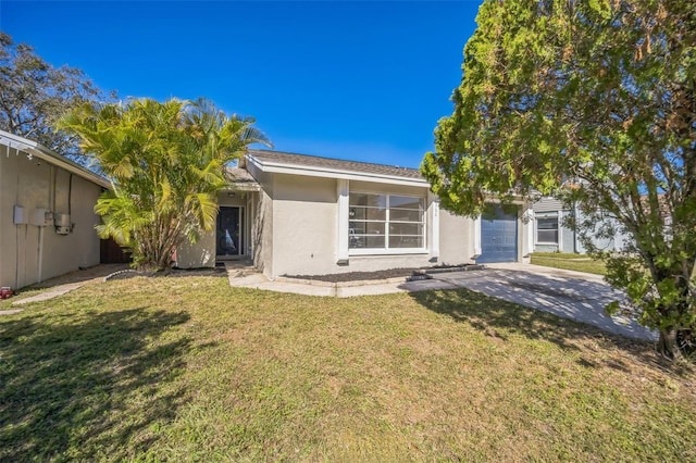 view of front of house featuring a front yard and a garage