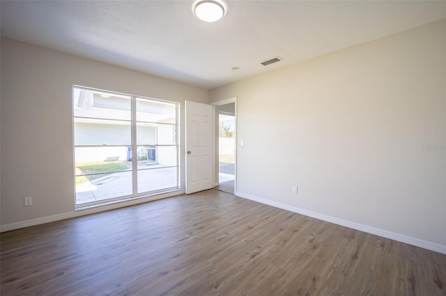 empty room featuring wood-type flooring